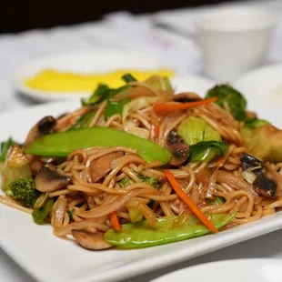 a plate of noodles and vegetables