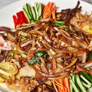 a plate of stir fried noodles