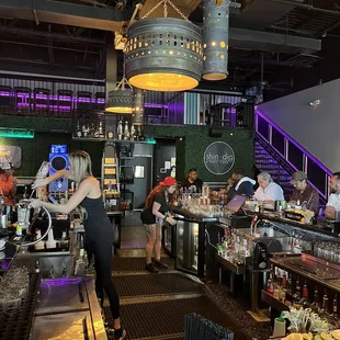 a busy bar with a lot of people