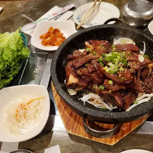 Marinated beef short ribs.  2 servings. The meat is so tasty. put some radish and wrap with lettuce or like me just eat it with rice!!