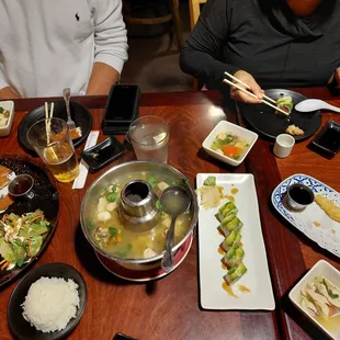 From left to right:  Pork and fish cutlet combo, Tom yum soup chicken, eel roll, tempura.