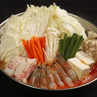 ows a variety of ingredients in a bowl