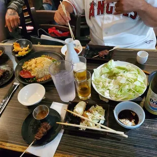 Cabbage salad, shrimp fried rice, kobe beef, kimchi, Orion beer. And family time