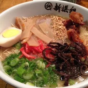 Added karamiso, tamago, menma, mushroom, fried garlic chips &amp; bacon to my extra-firm noodle, extra oil, strong broth bowl