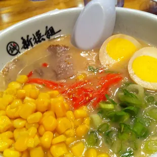 1/2 ramen with green onion, sesame, ginger, pork (added flavor egg and corn), $6.25