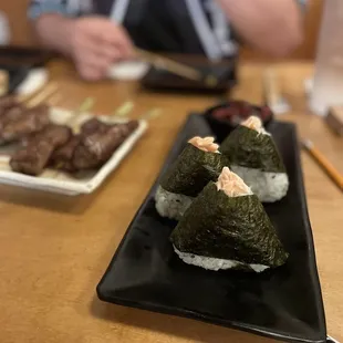 Salmon Onigiri with fermented plum on the side