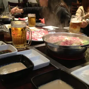 6 people, 2 bowls of Shabu Shabu, 1 hibachi grill and 3 pitchers of Sappo beer.