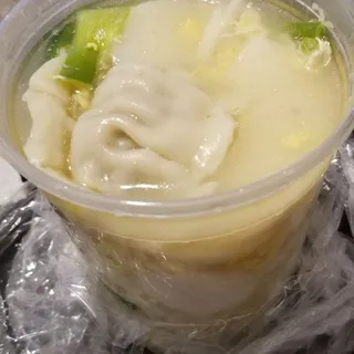 Tasty Dumpling, Rice Cake And Egg In Beef Broth