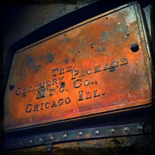 a rusted sign for the chicago oil company