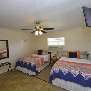 Room 5 has 2 full beds for up to 4 guests.