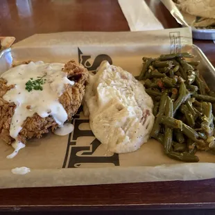 Chicken fried steak with mashed potatoes and green beans