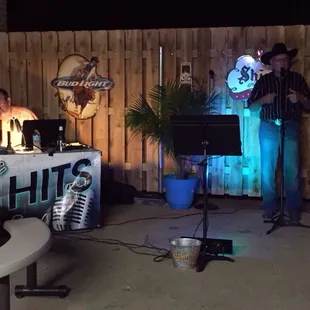 a man standing in front of a microphone