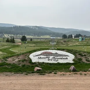 a sign for shining mountain golf course