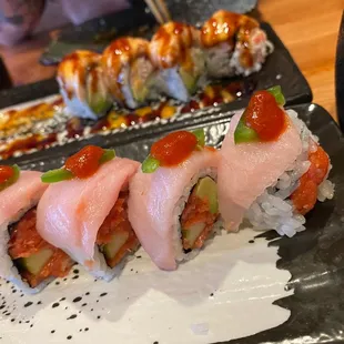 a plate of sushi rolls