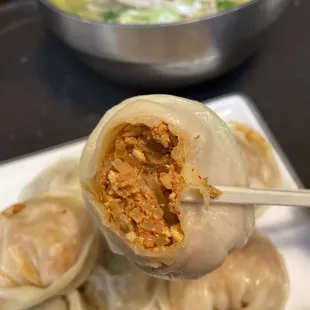 a plate of dumplings and a bowl of soup
