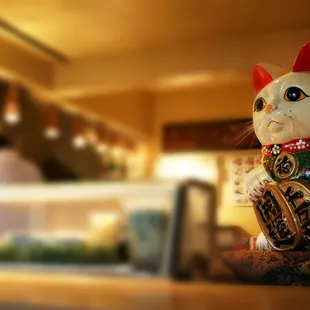 a cat figurine on a counter