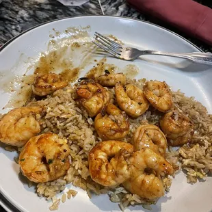 a plate of shrimp and rice