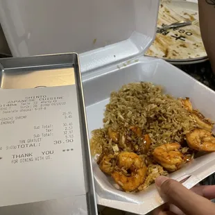 a plate of shrimp and rice