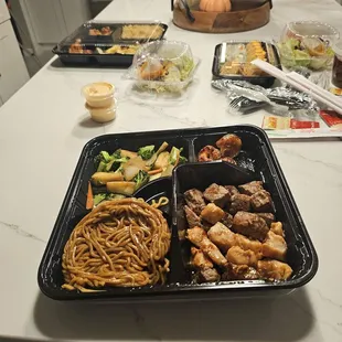 Chicken and steak hibachi three shrimp veggies and noodles.