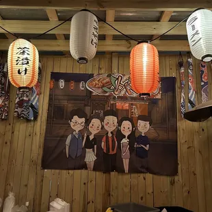 japanese characters hanging from the ceiling