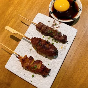 LEFT to RIGHT- not sure (could be pork neck or chicken cartilage or momo), tsukune, beef tongue, chef sauce (for tsukune)