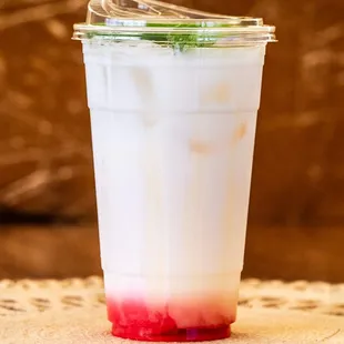 Bandung Fizzy -- a sparkling take on a classic Singaporean drink, made with condensed milk, rose syrup and mint