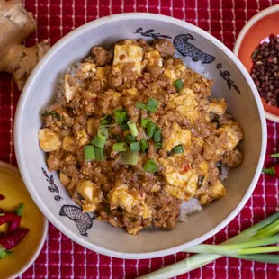 Grandma's Szechuan Mapo Tofu -- a hearty blend of pork, tofu, and fragrant spices, served over rice