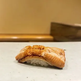 a piece of salmon on a cutting board