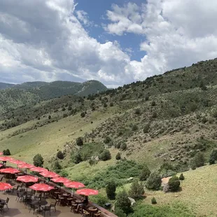 The red umbrellas show where the restaurant patio is located.. This photo was taken on the walk from the parking lot to the main level.