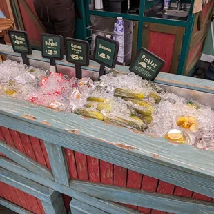 a display of pickles and lemons