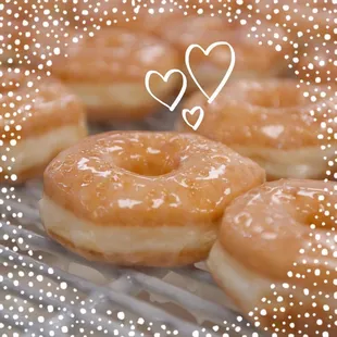 a closeup of a dozen donuts