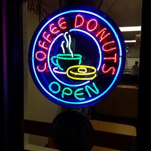 a neon sign for a coffee shop