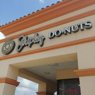 the entrance to a donut shop