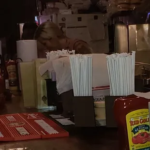 Cool grill behind bar, the team rocked out a boatload off burgers