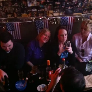 a group of people sitting around a table