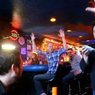 a group of people at a bar