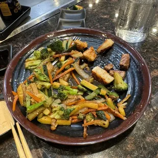 a plate of stir fried vegetables