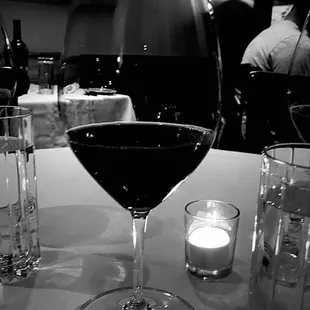 a glass of wine on a table