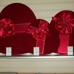 three red heart shaped boxes