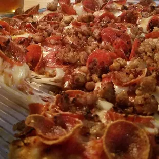 a pizza with meat and cheese