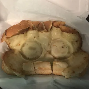 Garlic bread was a little bit soggy. The two round circles are from the marinara sauce cups lol..