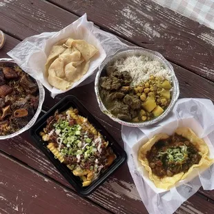 Stew Oxtail, Curry Goat, Oxtail Fries, and Doubles