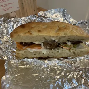 Full lemongrass meatball bahn mi on homemade focaccia