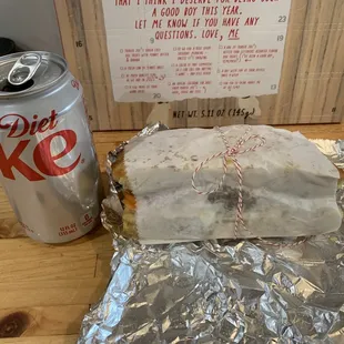 Sandwich next to a can of soda to show size