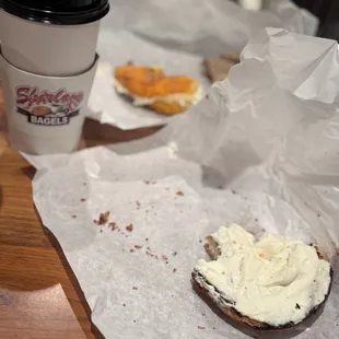 Cinnamon sugar bagel toasted with cream cheese and a jalapeño bagel toasted with cream cheese.
