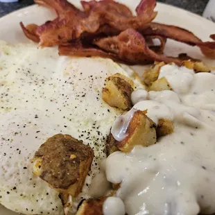 Two over easy, home fries with country gravy, bacon