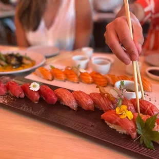 Regular tuna, fatty tuna and salmon cuts that sit behind. The best quality of nigiri  you&apos;ll find in all of SA.