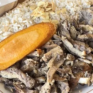 a plate of fish and rice