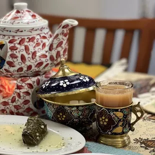 a teapot and a plate of food