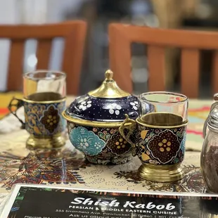 three cups of tea on a table